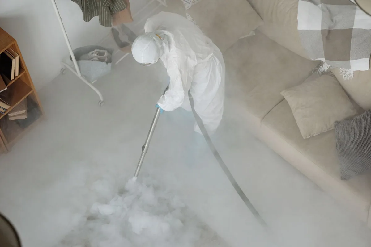 Biohazard cleanup technician in protective equipment, Princeton, MN